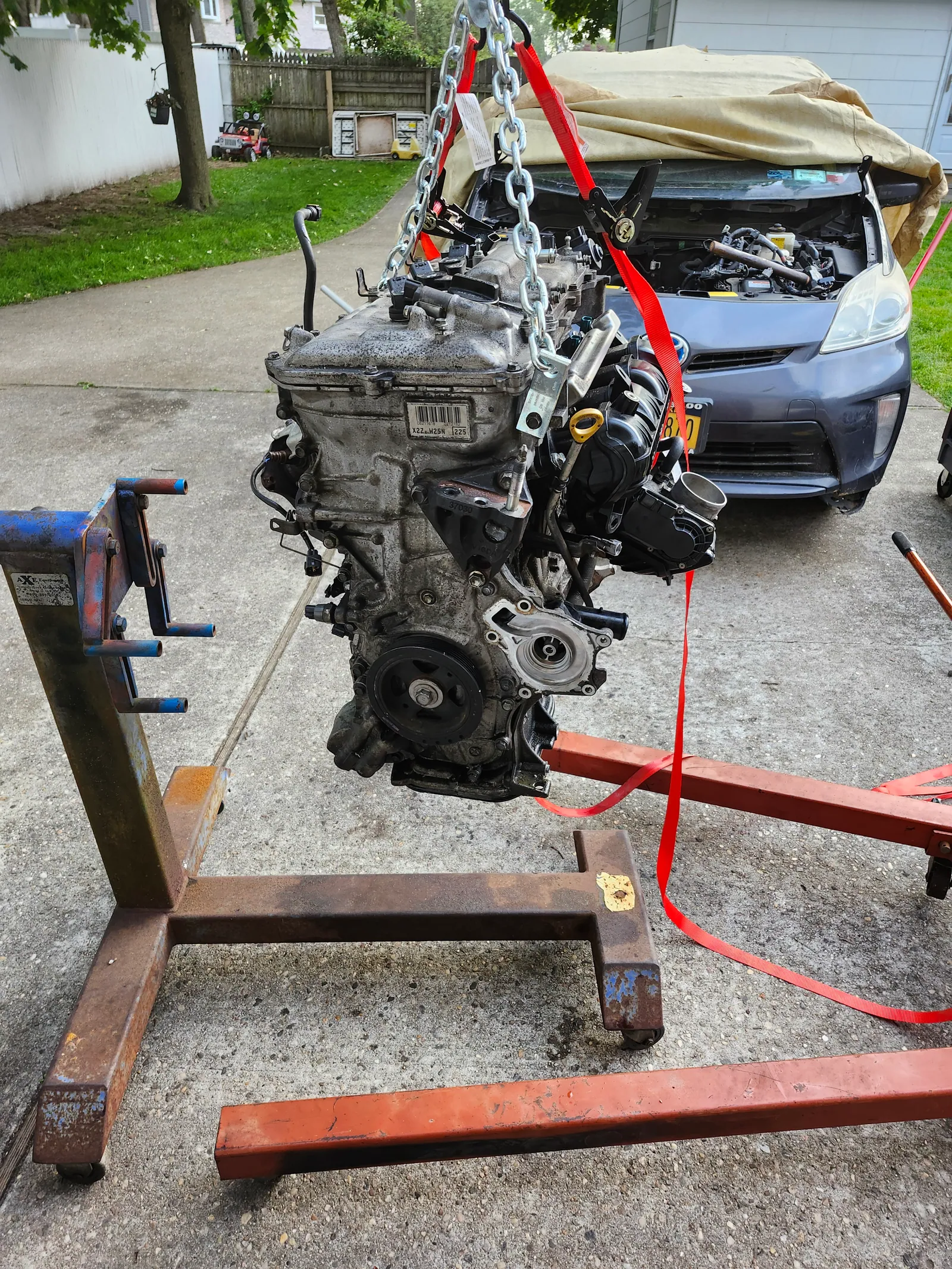 Toyota Prius engine removal and swap with hoist in shop
