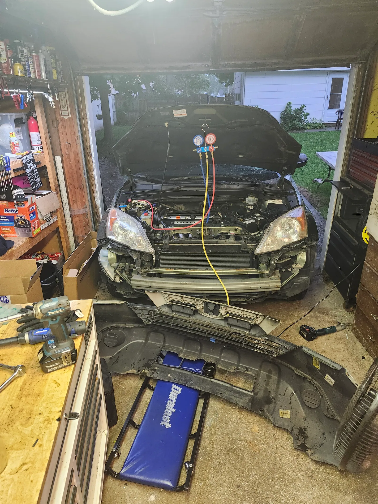Honda CR-V with front bumper removed for AC and cooling system service