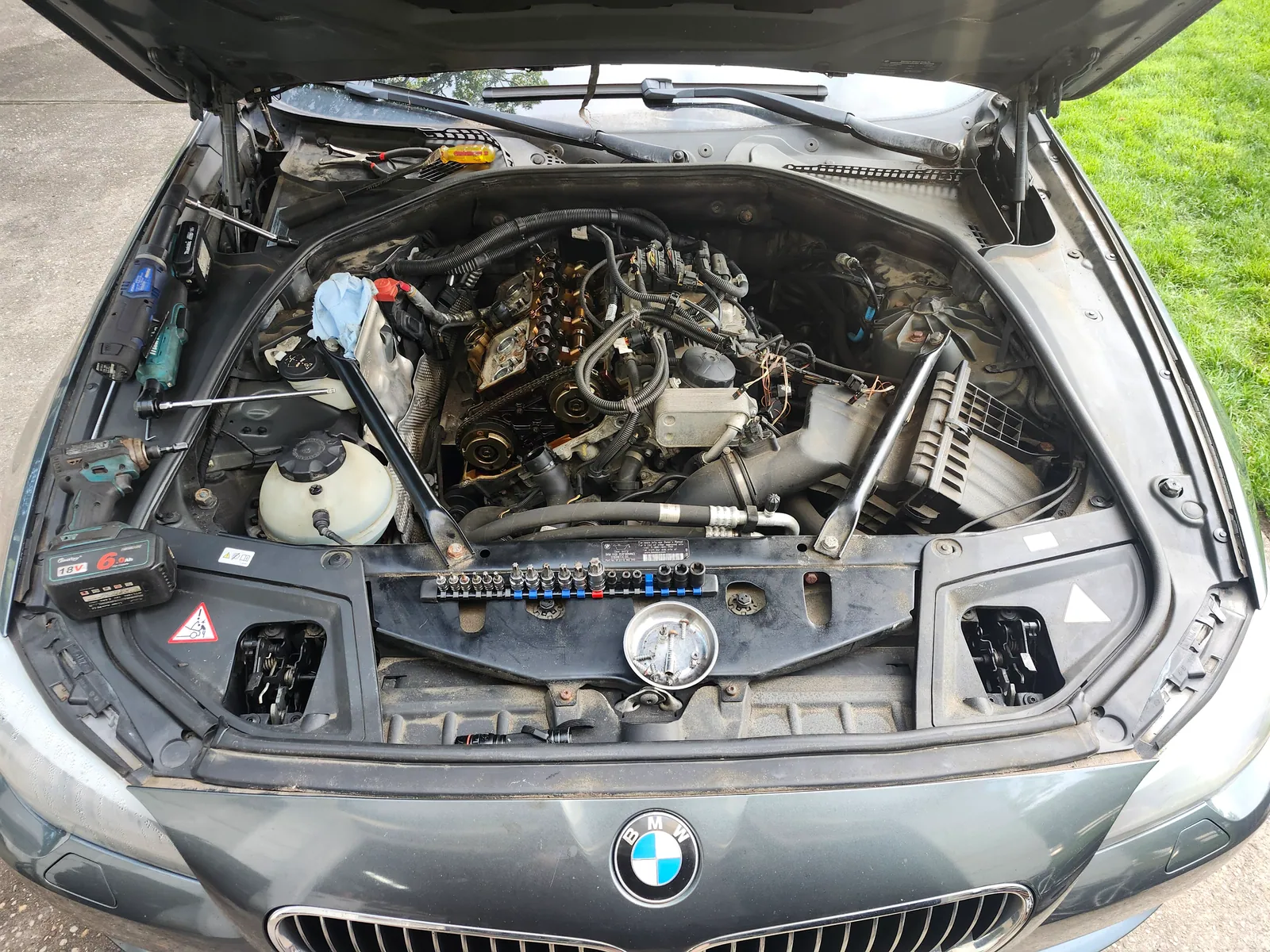 BMW N20 engine teardown and inspection with components laid out