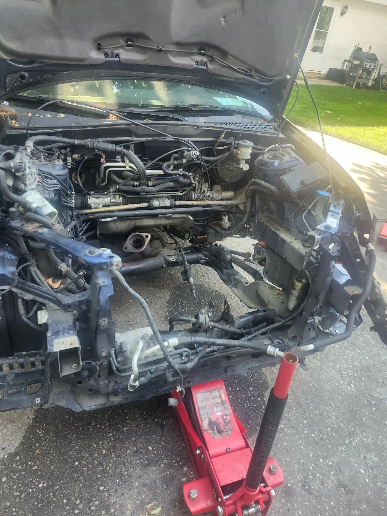 Honda K20 engine swap in progress with engine bay preparation